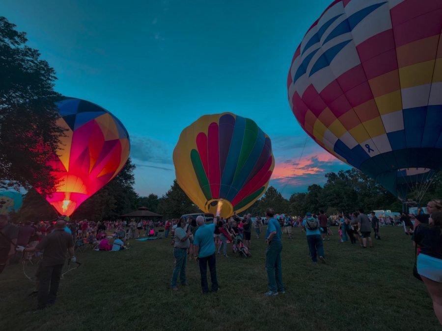 Attendees watch hot air balloons rise for the Balloon Glow Aug. 20, 2022 at the Centralia Balloon Festival in Centralia, Ill.
