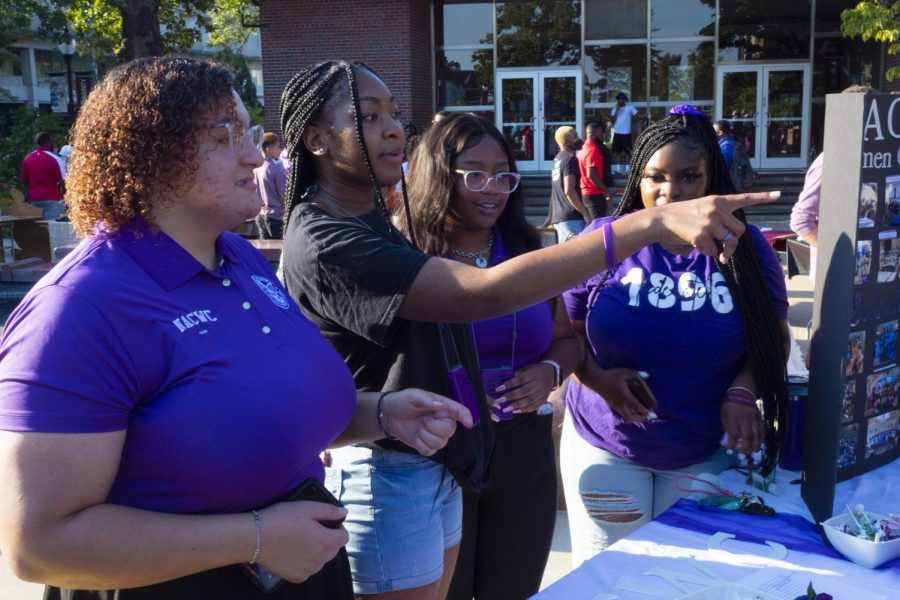 Members of National Association Of Colored Women Clubs Inc speak with students interested in their organization Aug. 25, 2022 at Faner Plaza Involvement Fair in Carbondale, Ill. “We are the most active Black organization on campus,” Jessica White said. 