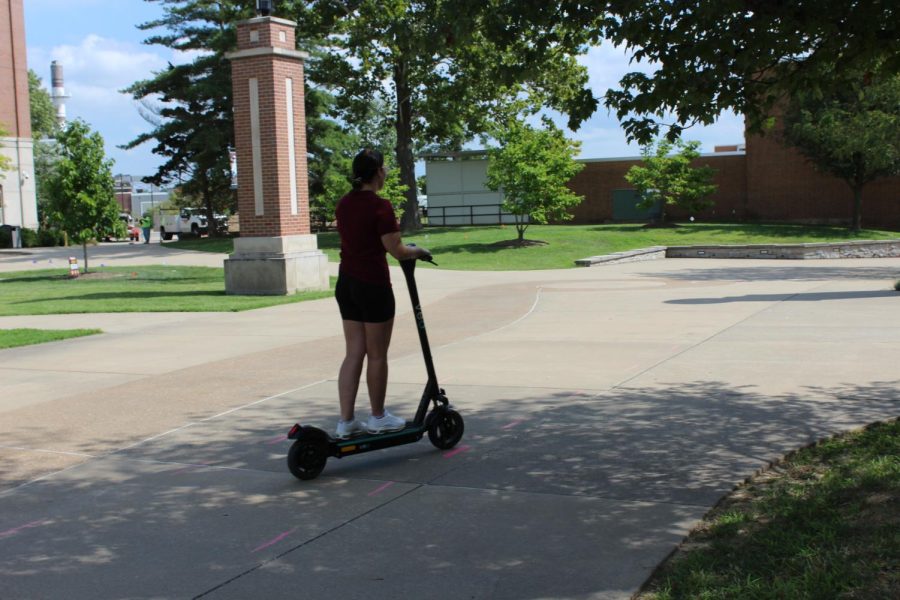 A student rides a Veo scooter on campus on Aug. 14, 2020. The scooters are generating complaints because some people are riding recklessly or parking the scooters where they are blocking wheelchair access to sidewalks.