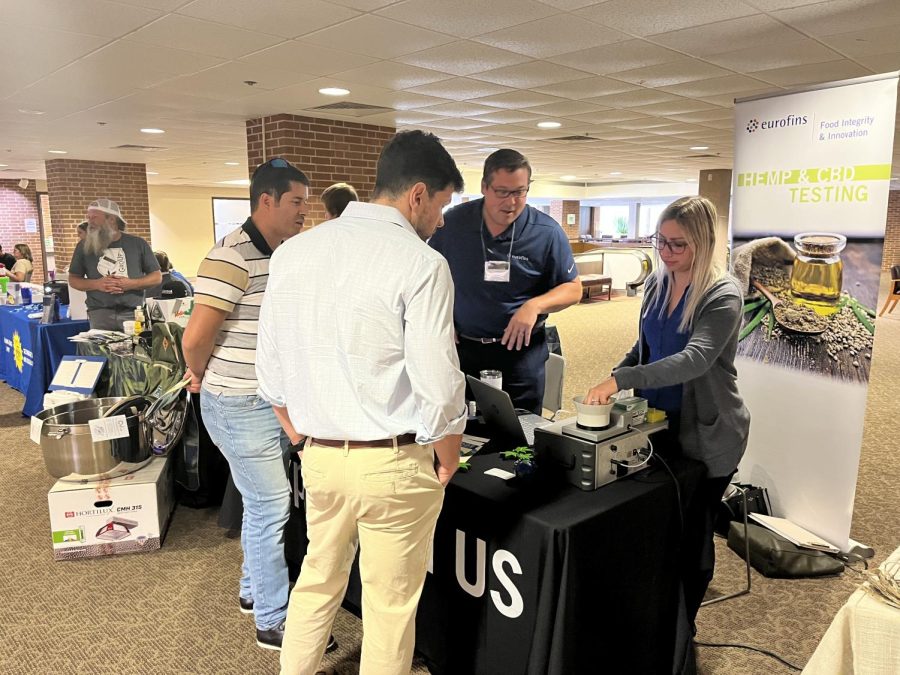 Eurofins employees speak to people who had questions about what their company has to offer for medicinal CBD oil Sept. 18th, 2022 in the Student Center in Carbondale, Ill. 