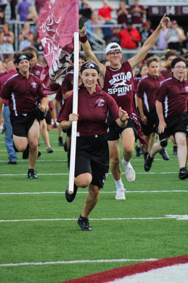 Students race down the field in the annual Saluki Sprint taking place during the home opener against Southeast Missouri State University Sept. 10, 2022 at Saluki Stadium in Carbondale, Ill.