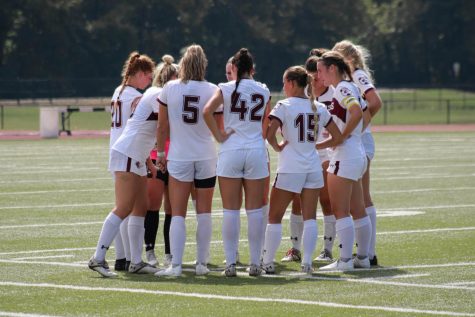 The Saluki Soccer team huddles together before the second half of the match against Drake University Bulldogs on Sept. 18, 2022 at the Lew Hartzog Track & Field Complex in Carbondale, Ill.