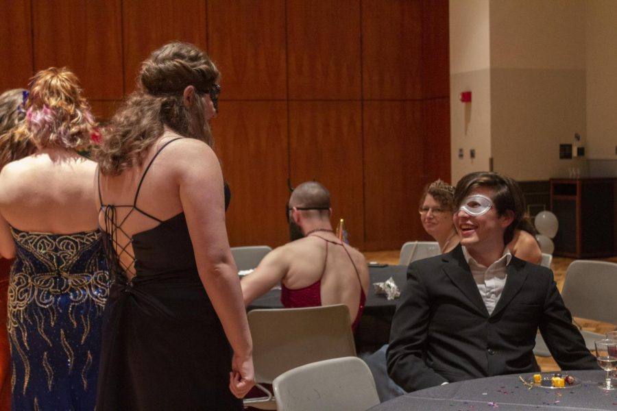 Guests socialize at the masquerade ball hosted by the Africana Theater Lab Sept. 23, 2022 at the SIU Student Center Ballroom in Carbondale, Ill.
