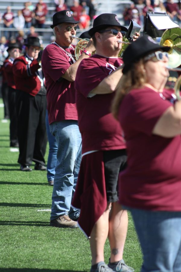 Marching Saluki Alumni play along with The Marching Salukis for their combined performance during the homecoming game Oct. 15, 2022 at Saluki Stadium in Carbondale, Ill. 
