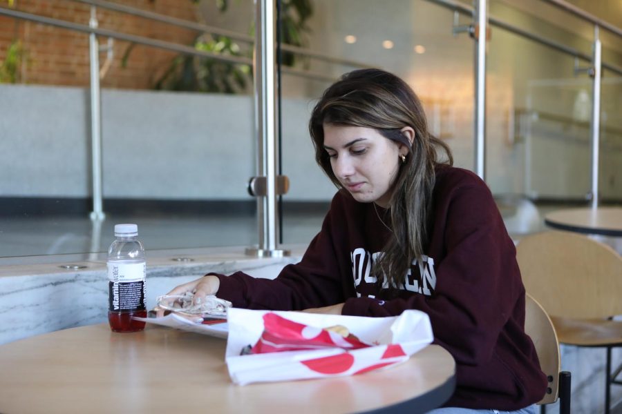 Freshman Karsyn Bailey, a Dental Hygiene major, enjoys lunch and studies for her Chemistry test Oct. 21, 2022 at the Student Center in Carbondale, Ill. “I’m a freshman so it’s a lot of learning about time management and adjusting to college life. If I’m being honest, I study in my dorm. I like how it’s quiet and I’m by myself,” Bailey said.