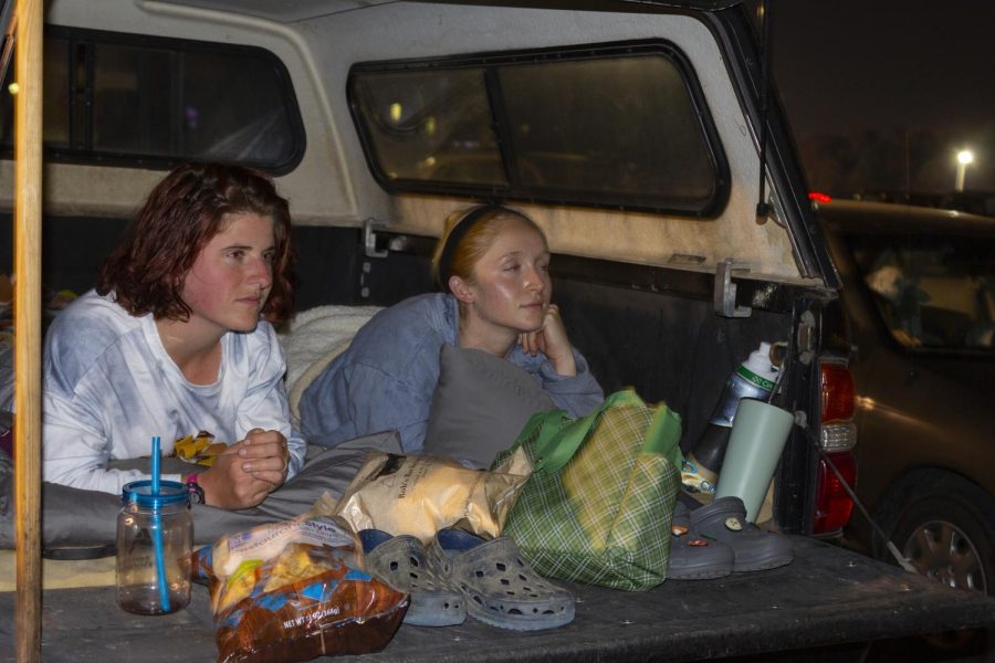 SIU students sit in the trunk of their truck and enjoy the Harry Potter movie Oct. 11, 2022 at Saluki Stadium lot 56 in Carbondale, Ill.