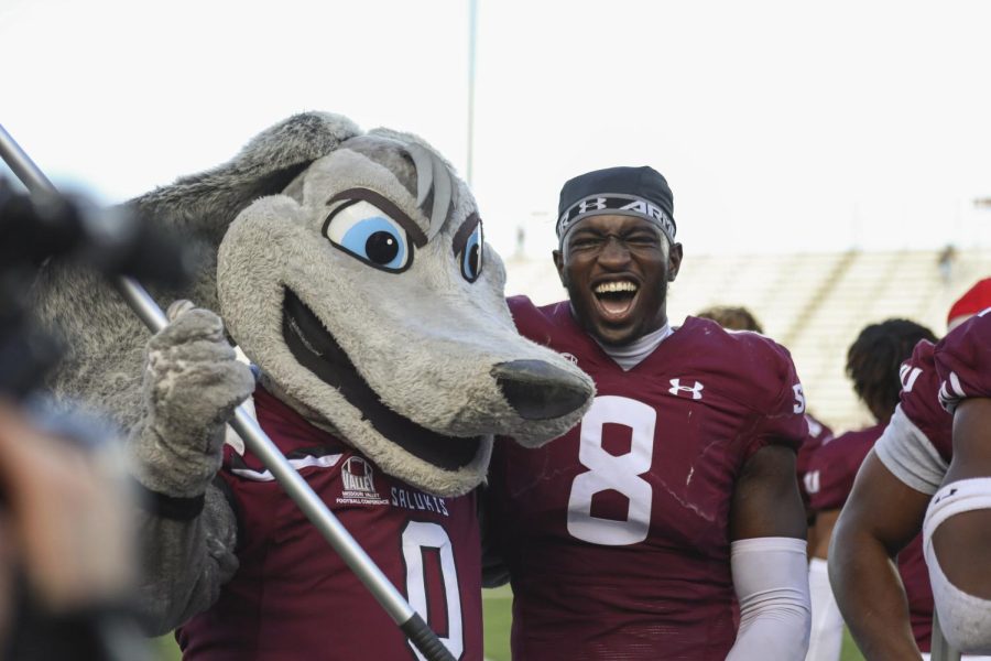 Ma’Kel Calhoun (8) celebrates the homecoming win with Grey Dawg after the game against Western Illinois Oct. 15, 2022 at Saluki Stadium in Carbondale, Ill.