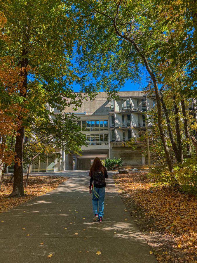 Sydney Shaw walks briskley to her next class Oct. 19, 2022 at Faner Hall in Carbondale, Ill. “Walking through the woods during the fall has been so pretty,” Shaw said.