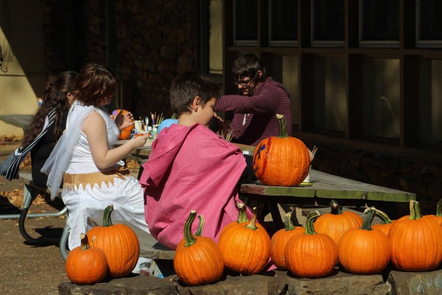 
Children enjoy painting pumpkins at The Haunted Hollow event Oct. 23, 2022 at Touch of Nature in Makanda, Ill. 