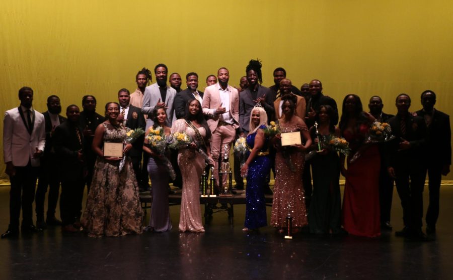 The contestants of Miss Eboness and members of the Beta Eta Chapter of Alpha Phi pose on stage after the  49th annual Miss Eboness pageant Oct. 15, 2022 at Shyrock Auditorium in Carbondale, Ill.