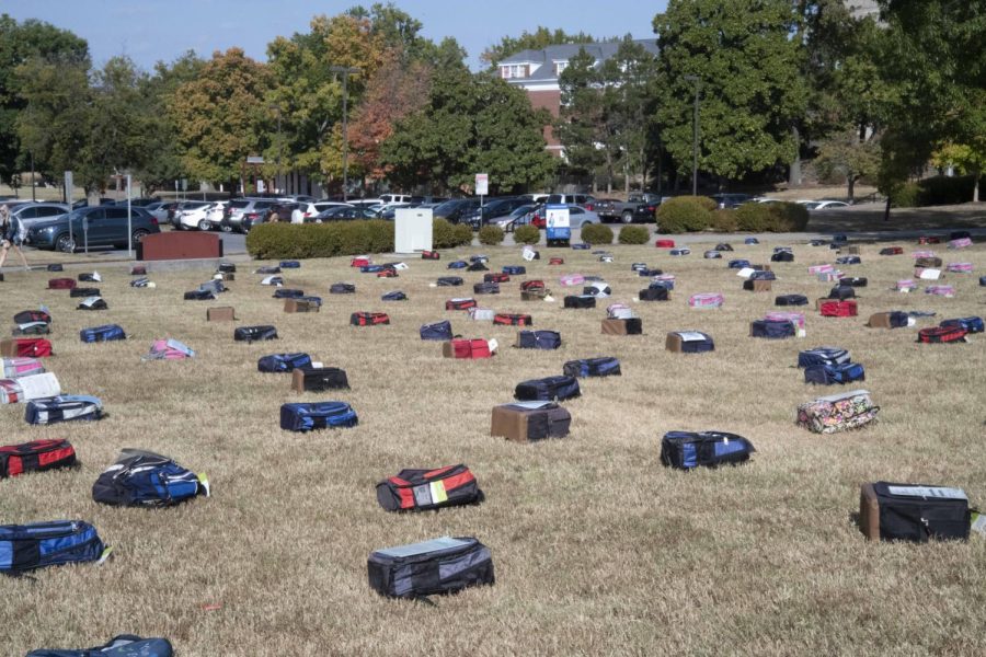 Backpacks lay out across Morris Library Lawn Oct. 10, 2022 at Morris Library in Carbondale, Ill. 