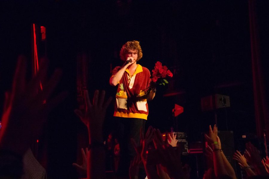 Yung Gravy hands out roses to the crowd during his concert at Shryock Auditorium Oct. 12, 2022 in Carbondale, Ill. 