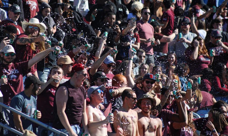 Setting a Guinness World Record for the most cans opened at once, the SIU crowd spray their drinks in celebration of the event Oct. 15, 2022 at Saluki Stadium in Carbondale, Ill.