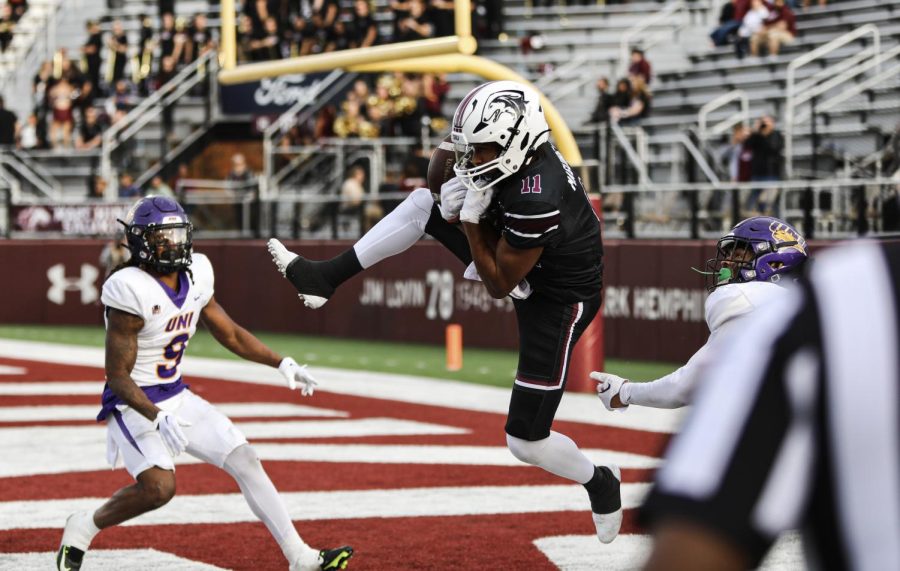 Avante Cox (11) catches the pass mid air bringing in another touchdown for Southern Illinois during the Blackout Cancer game Oct. 29, 2022 at Saluki Stadium in Carbondale, Ill.