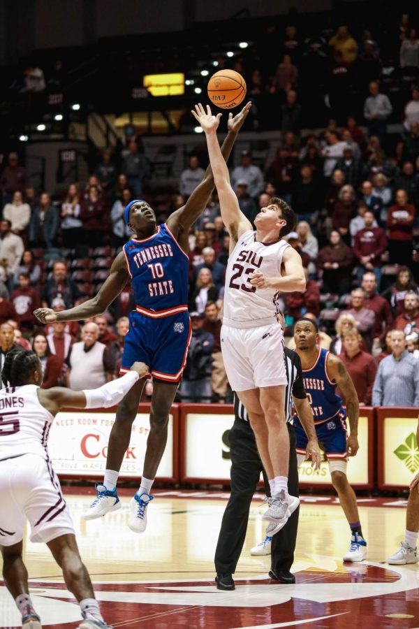 Troy D’Amico (23) and Adong Makuoi (10) jump up for the tipoff during the home game against Tennessee State Nov. 17, 2022 at the Banterra Center in Carbondale, Ill.