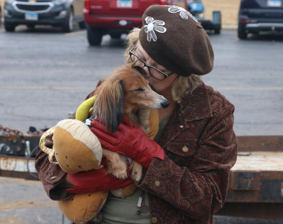 Leslie Lloyd kisses her dog Gustav, winner of the Funniest/Silliest pet costume, after the pet parade held during the Howl-o-Ween event Oct. 29, 2022 at Murdale Shopping Center in Carbondale, Ill. 