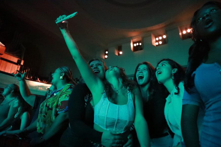 A group of SIU students take a video together during the Yung Gravy concert Oct. 12, 2022 at Shryock Auditorium in Carbondale, Ill.