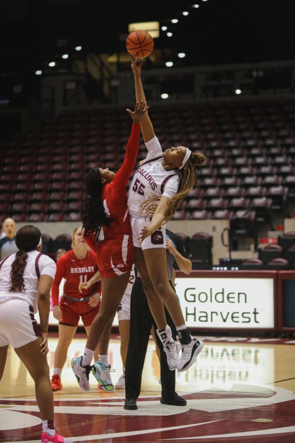 Promise Taylor (55) wins the ball over for the Salukis in the tip-off against Isis Fitch (24) of Bradley University Jan. 5, 2023 at the Banterra Center in Carbondale Ill.