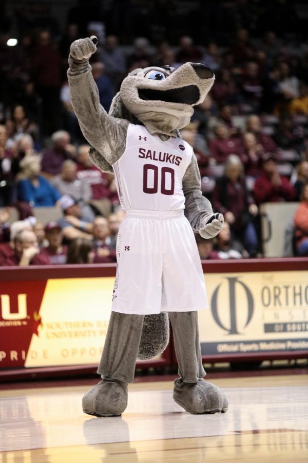 Grey Dawg pumps his arm to the SIU Fight Song during halftime of the game against Evansville University Jan. 17, 2022 at Banterra Center in Carbondale, Ill. 