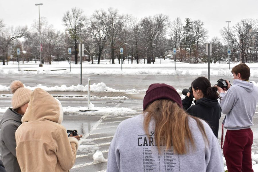 After a late start to the day due to inclement weather, Julia Rendlemen’s photojournalism class heads outside to work on the basics of camera exposure Jan. 25, 2023 at the communications building on campus in Carbondale, Ill.