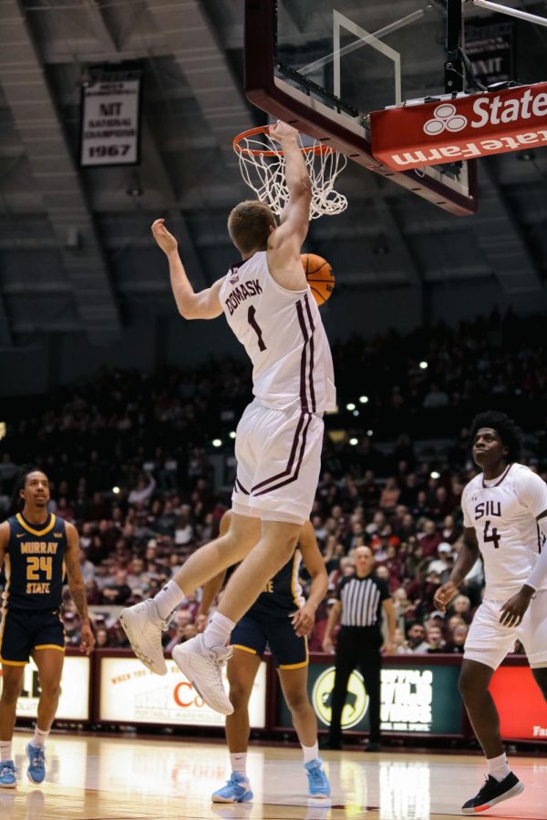 Marcus Domask (1) comes down off the basket from the dunk against Murray State helping put the Salukis further in the lead Jan. 25, 2022 at Banterra Center in Carbondale, Ill. 