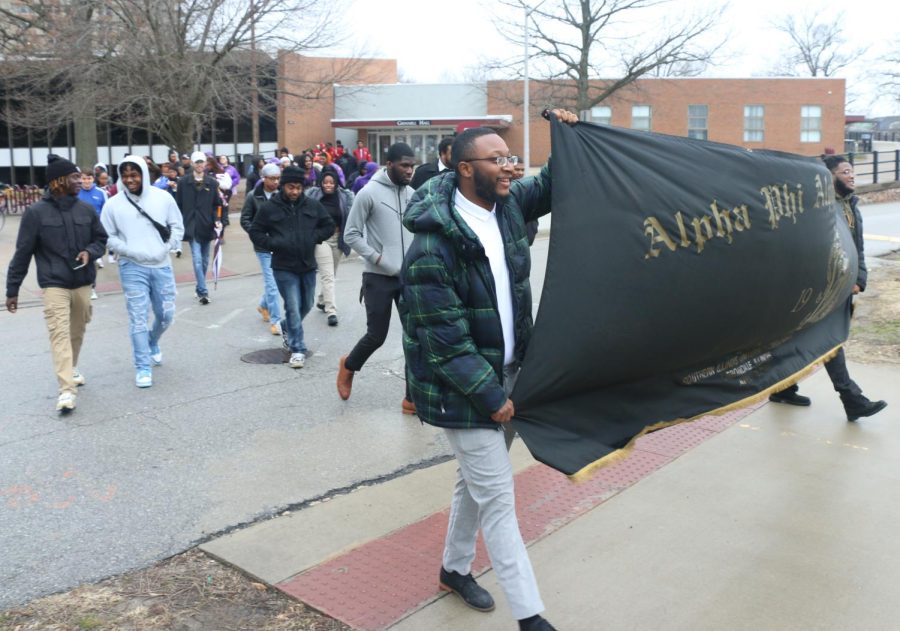 Andre Council and Nigel Singleton, president of the Beta Eta Chapter of Alpha Phi Alpha, lead the MLK march on Monday, Jan. 16 in Carbondale, Ill.