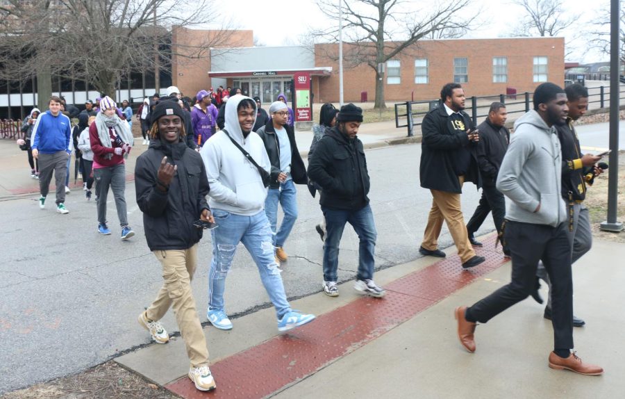 Attendees of the MLK Day march  start the march at Grinnell Hall on Monday Jan. 16, in Carbondale, Ill.