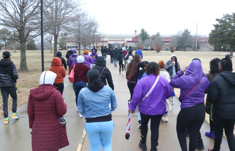Attendees of the MLK Day march walk towards S Illinois Ave on Monday Jan. 16, at the Southern Illinois University campus in Carbondale, Ill.