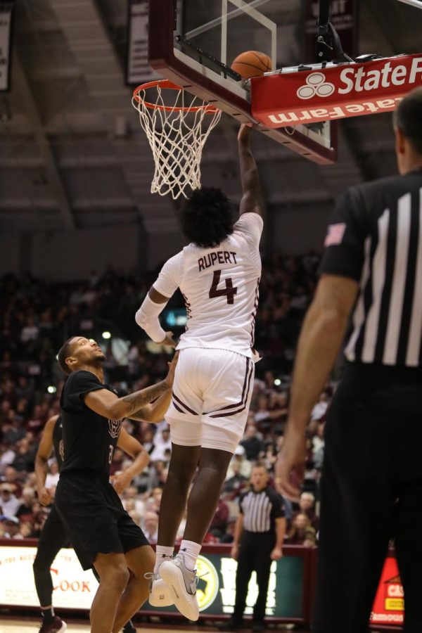 Clarence Rupert (4) leaps to put the ball in the basket against the defending Missouri State Feb. 5, 2022 at Banterra Center in Carbondale, Ill.
