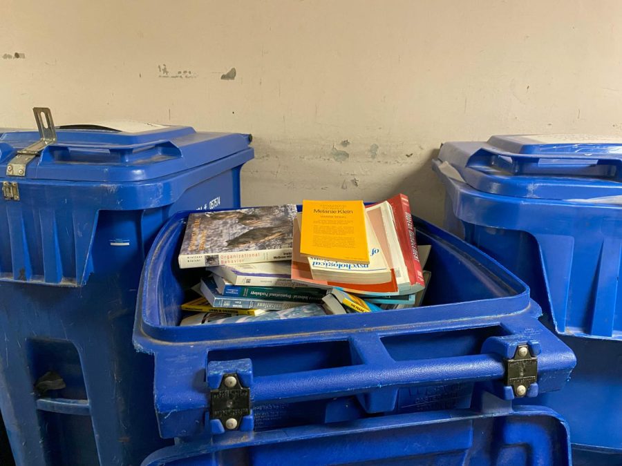 Dozens of books found in the trash at the bottom floor of Life Science II Jan. 12, 2023 at Southern Illinois University in Carbondale, Ill.