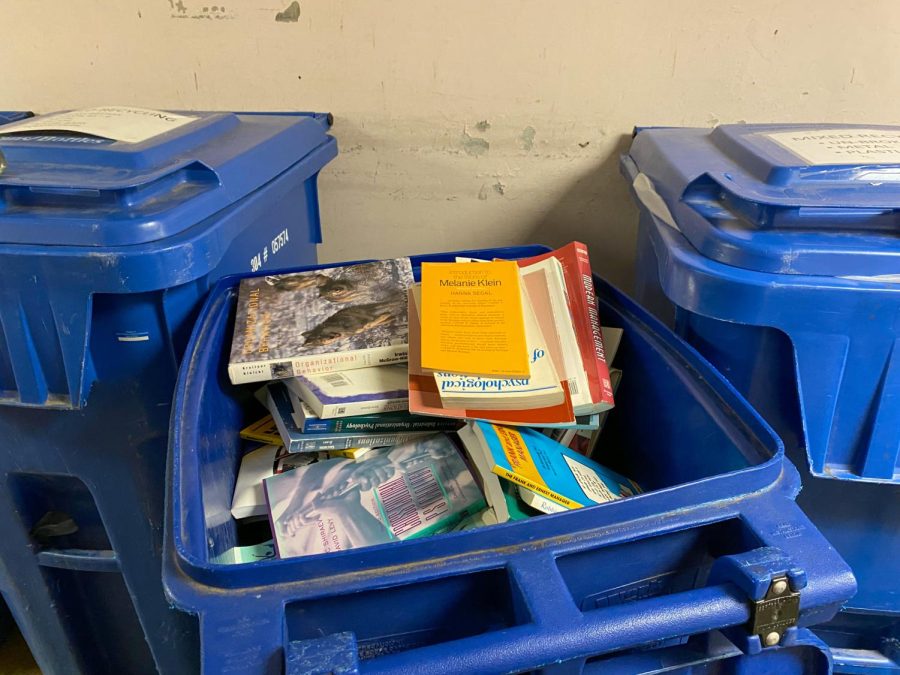 Dozens of books found in the trash at the bottom floor of Life Science II Jan. 12, 2023 at Southern Illinois University in Carbondale, Ill.