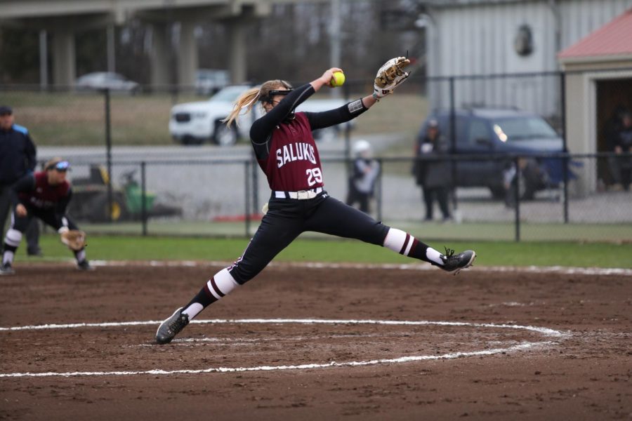 Elliott Stinson (29) winds up for the pitch when the Salukis take on the Cougars of Southern Illinois University Edwardsville at home Feb. 26, 2023 at Charlotte West Stadium in Carbondale, Ill.