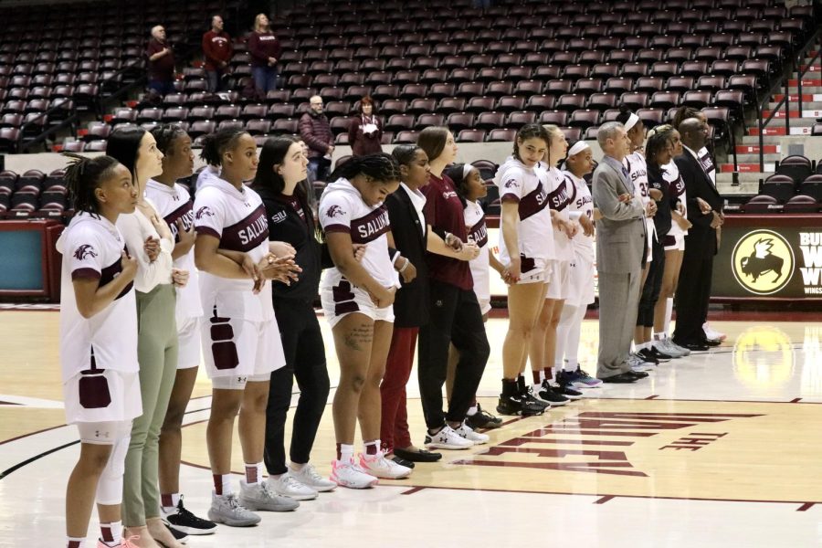 The Salukis line up for the National Anthem together at the Women’s Basketball game on  Feb. 23, 2023 at the SIU Banterra Center in Carbondale, Ill.