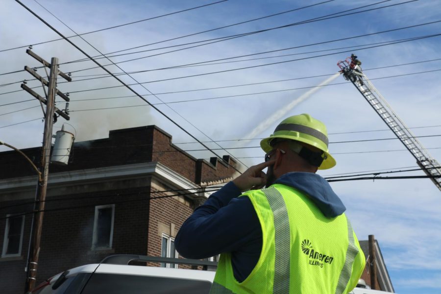 A city worker watches as the Carbondale and Murphysboro fire departments contain the fire at Missionary Baptist Church in Carbondale, Monday Feb. 6, 2023.