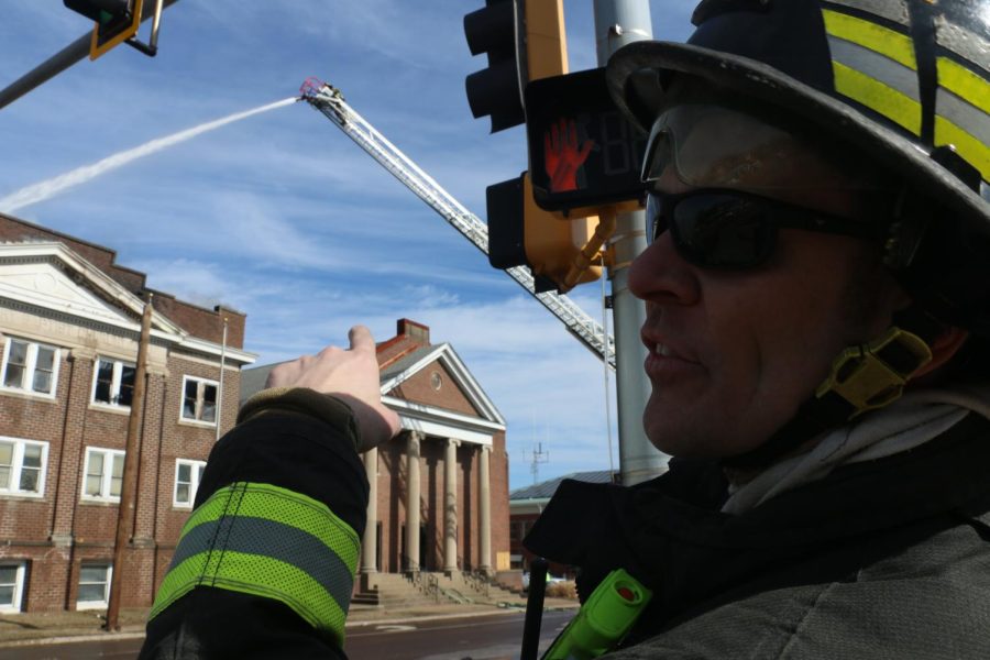 Murphysboro firefighter Jonathan Travelstead points to cracks in the church’s facade and explains that a portion of the building could fall. The Murphysboro Fire Department came to assist Carbondale firefighters in containing the fire that started at Missionary Baptist Church Monday Feb. 6, 2023.
