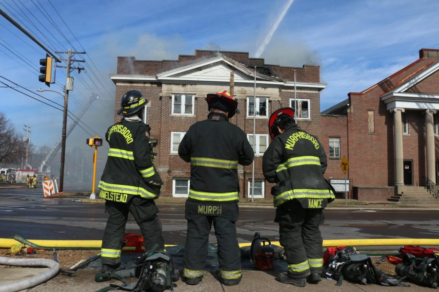 Three firefighters assess the damage during the fire at the Missionary Baptist Church in Carbondale, Monday Feb. 6, 2023.