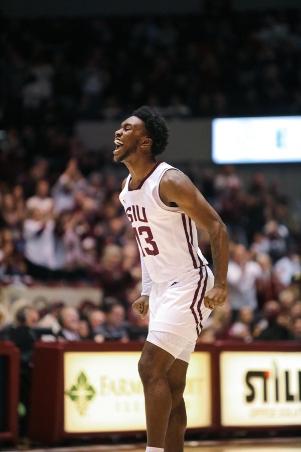 Jawaun Newton (13) yells in celebration after the Salukis pull ahead of Missouri State early in the game Feb. 5, 2023 at Banterra Center in Carbondale, Ill.