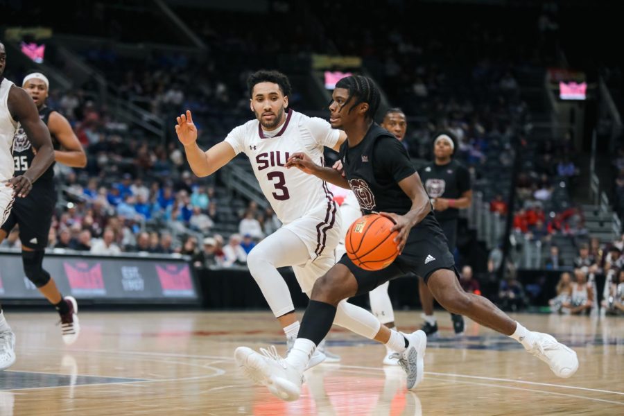 Dalton Banks (3) trails alongside Alston Mason (1) as he approaches the basket when the Salukis face the Bears of Missouri State in the Arch Madness Tournament Mar. 3, 2023 at the Enterprise Center in Saint Louis, MO.