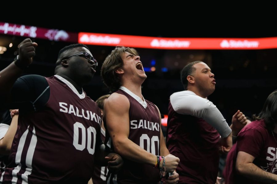 Tyler Lawrence, Canon Stearns, and Dylan Chambers cheer on the Salukis in The Missouri Valley tournament Mar. 4, 2023 at the Enterprise Center in St. Louis, MO.
