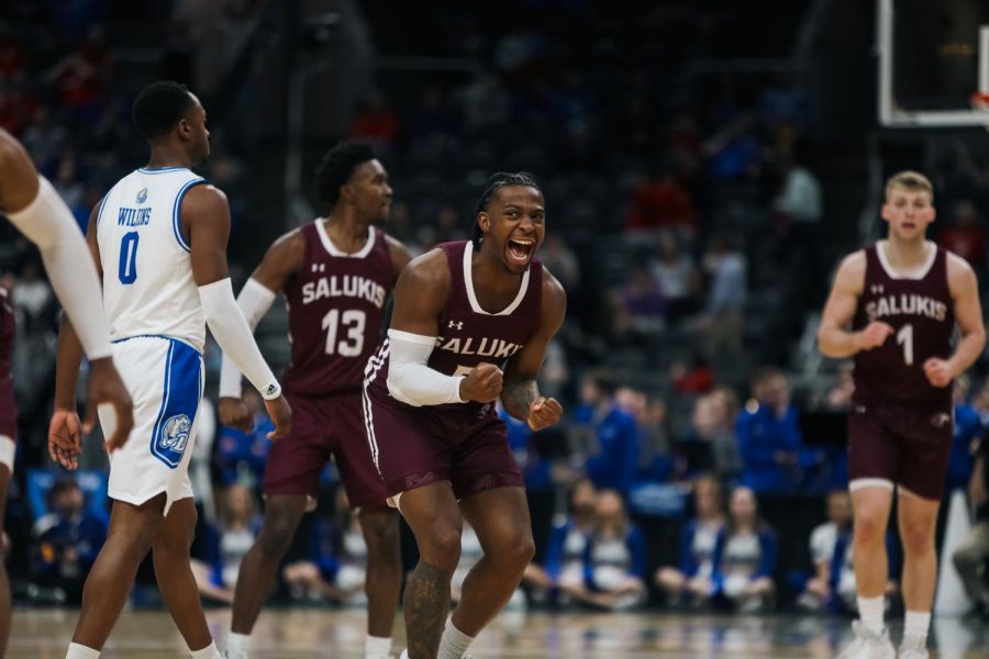 Lance Jones (5) yells in celebration as the Salukis catch up with the Drake Bulldogs in the second half at the Arch Madness Semifinal Mar. 4, 2023 at the Enterprise Center in Saint Louis, MO.