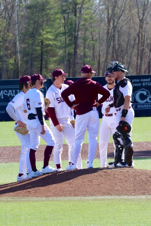 The Salukis discuss gameplay on a time-out March 04, 2023 at the Itchy Jones Stadium in Carbondale, Ill.