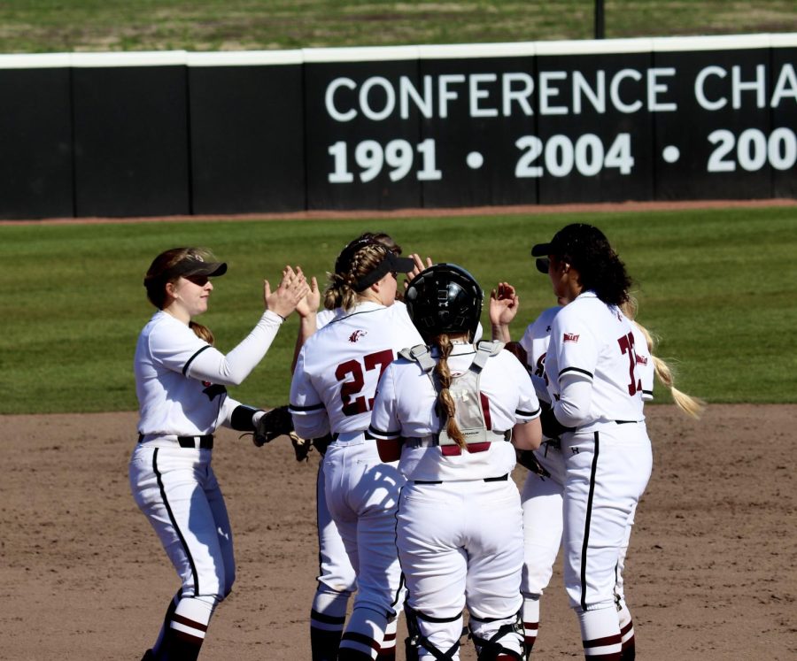 Salukis celebrate after an out was made in the first game of the conference play against the Beacons of Valpo March 17, 2023 at the Charlotte West Stadium in Carbondale, Ill.