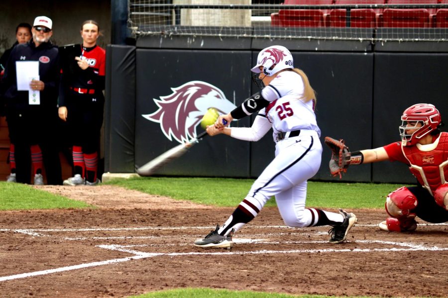 Tori Schullian (25) strikes the ball in the game against SEMO March 28, 2023 at the Charlotte West Stadium in Carbondale, Ill.