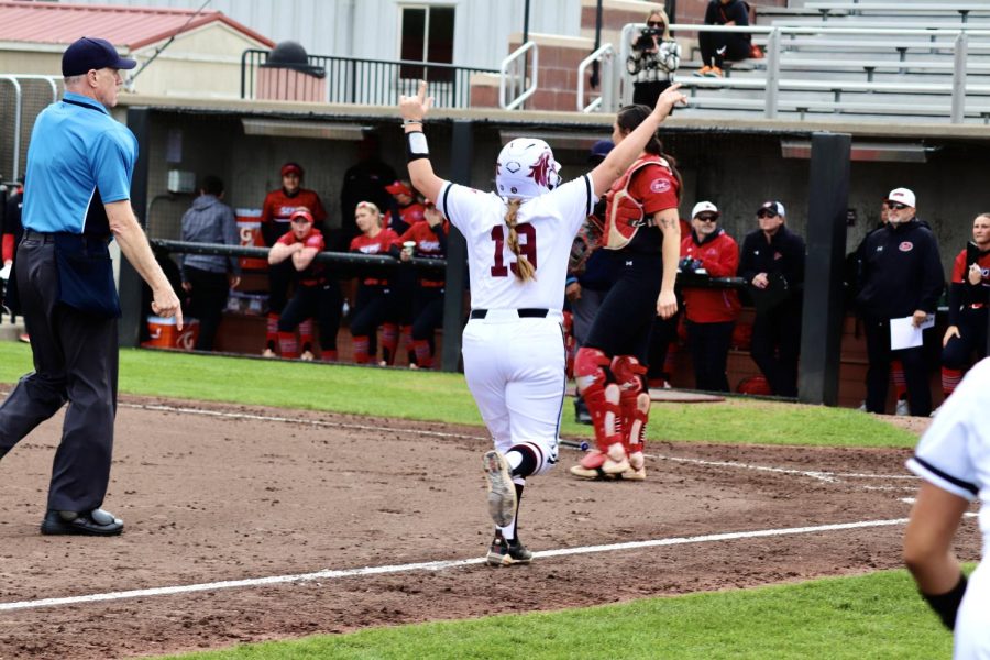 Anna Carder (19) celebrates after taking a first home run in the game against SEMO March 28, 2023 at the Charlotte West Stadium in Carbondale, Ill.
