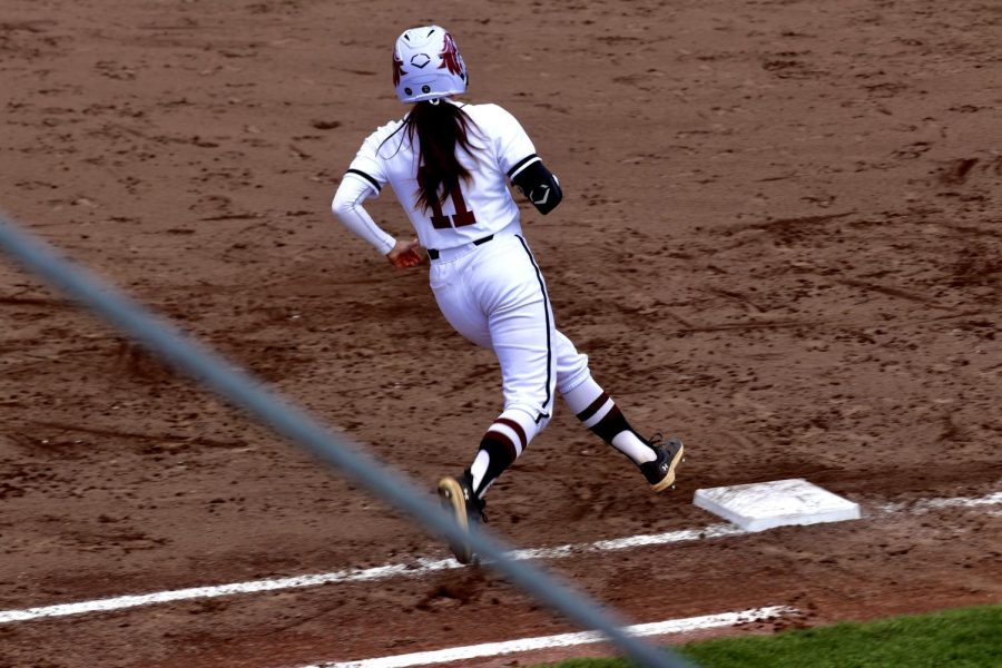 Aubree Depron (11) runs towards the first base in the game against SEMO March 28, 2023 at the Charlotte West Stadium in Carbondale, Ill.