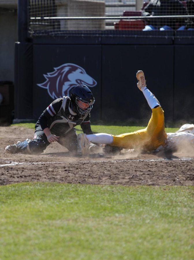 Anna Carder (19) tags out Taylor Herschbach (33) of Valparaiso at home to secure the Salukis their second out of the inning Mar. 19, 2023 at Charlotte West Stadium in Carbondale, Ill. 