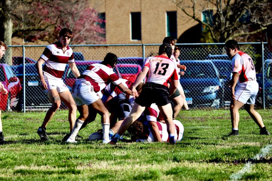 The Salukis get tackled in the game against Maryville April 01, 2023 at the Sam Rinella field in Carbondale, Ill.