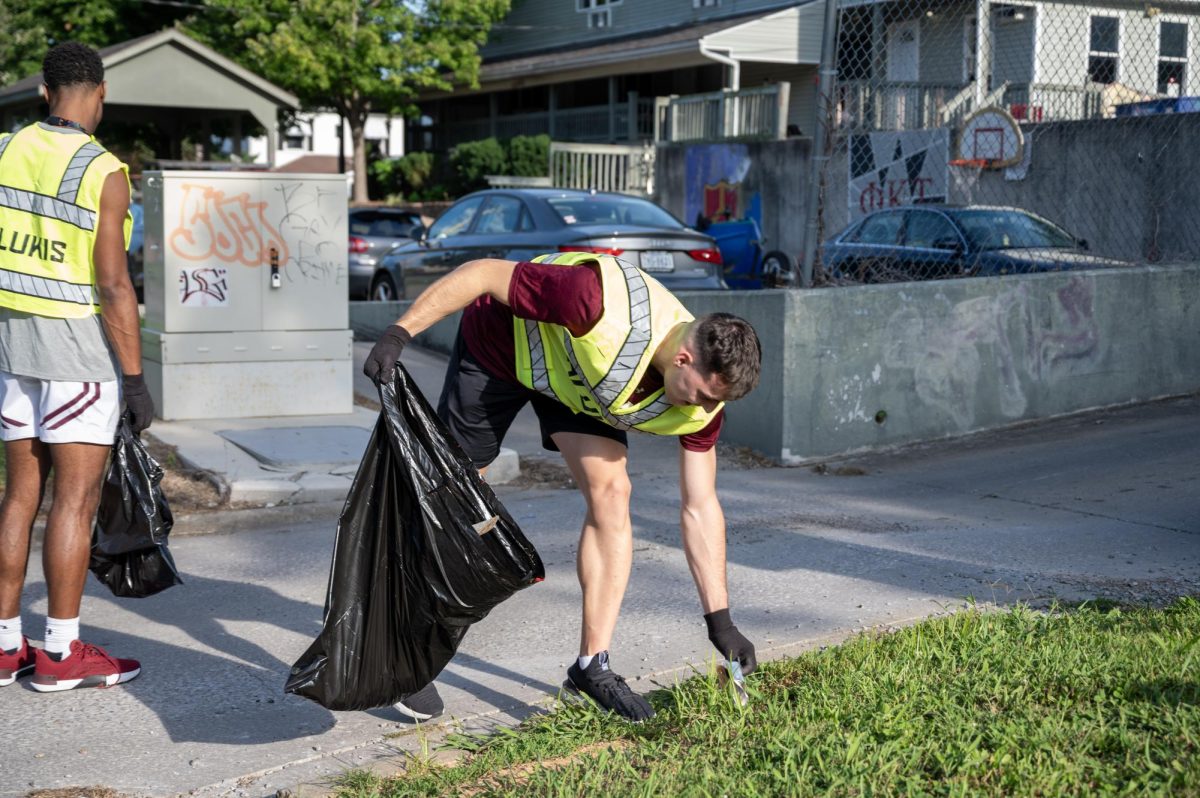 Graduate student and Saluki basketball guard Jovan Stulic helps support the community by picking up trash in the local neighborhoods Sept. 13, 2023 in Carbondale, Illinois. Nicole Fox | @fox.flicks 
