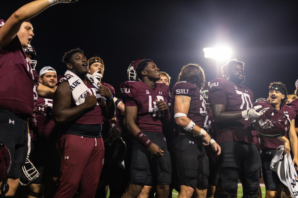 SIU+football+sings+the+school+fight+song+with+fans+in+the+stands+moments+after+the+Salukis+beat+the+Missouri+State+Bears+33-20+Sept.+30%2C+2023+at+Saluki+Stadium+in+Carbondale%2C+Illinois.+