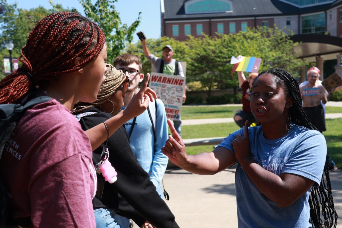 Megan Blohm and Kaliyah Radcliff debate back and forth during the protest Sept. 14th, 2023 in Carbondale, Illinois. 
